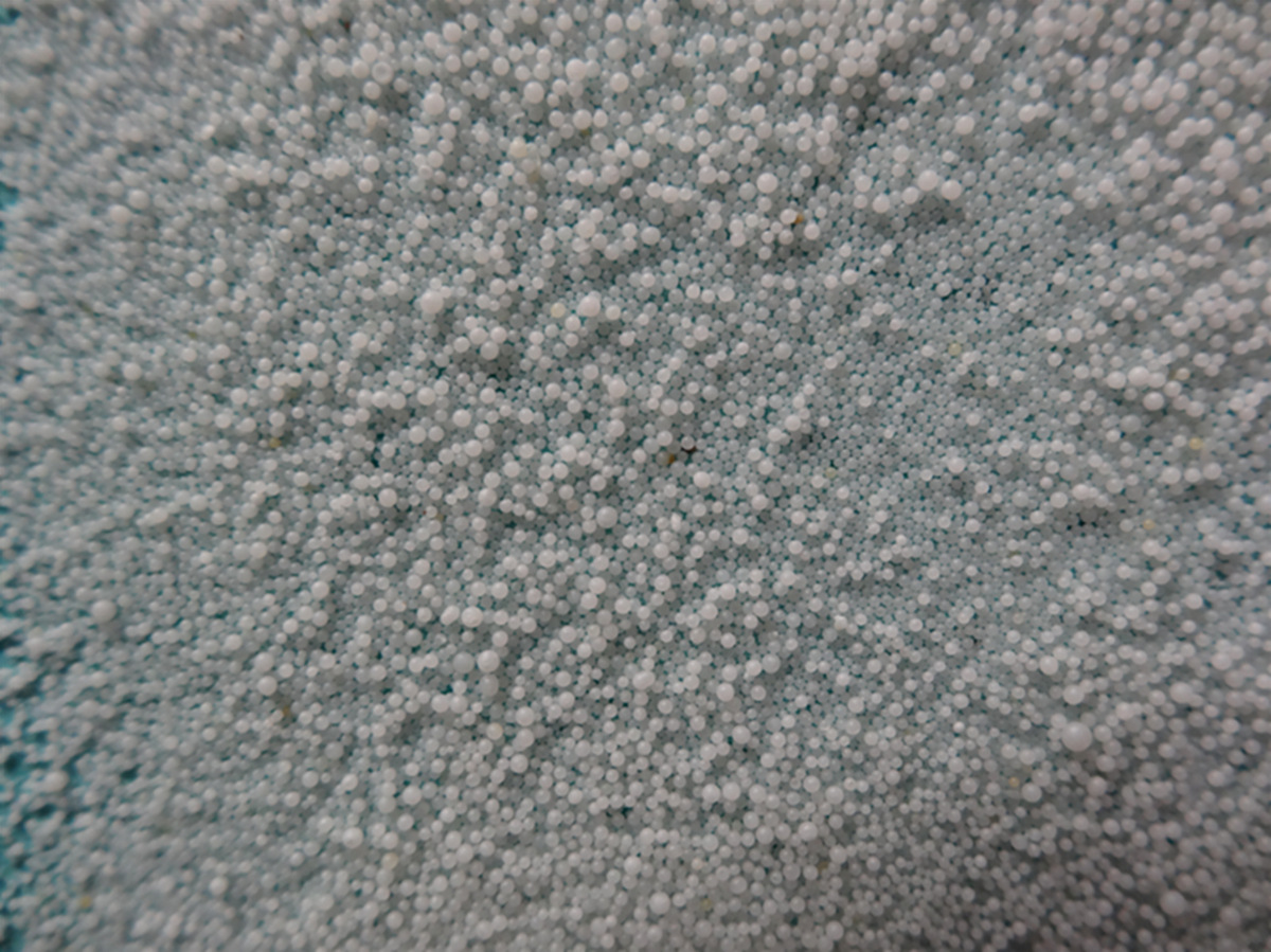 饲料酸化剂底喷流化床包衣工艺流程(冷凝喷丸造粒塔）